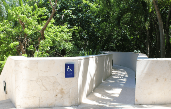 ADA ramp with lush foliage surrounding